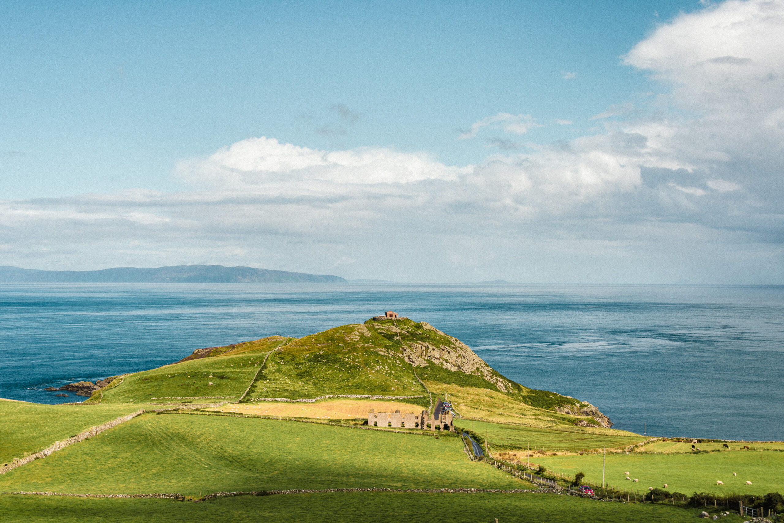 Coastal landscape with green hills