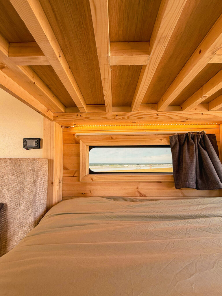 Cozy wooden campervan interior view.