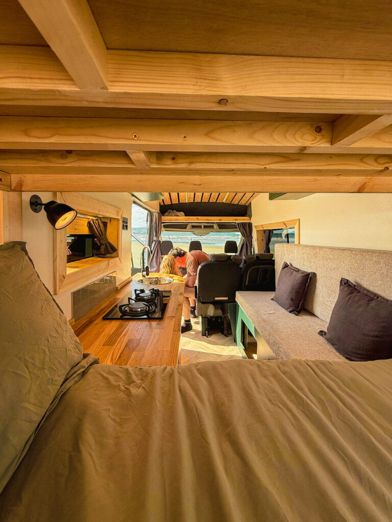 Cozy campervan interior with seating.