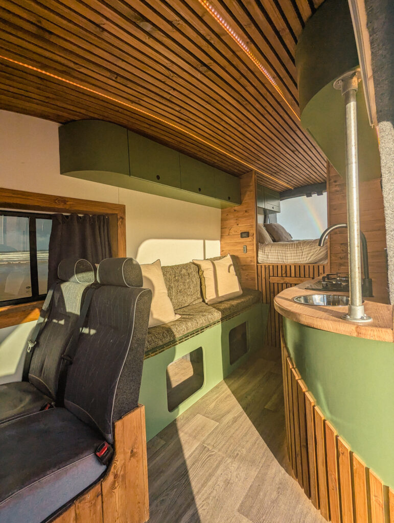 Cozy campervan interior with wood accents | campervan hire Northern Ireland | Karen & Co.