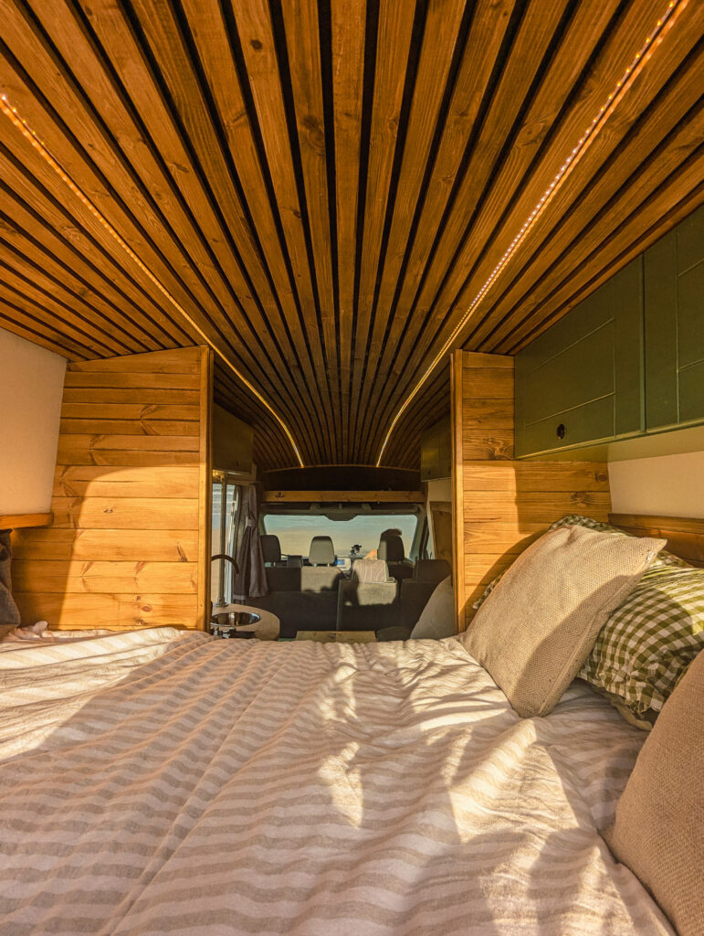 Cozy campervan interior with wooden ceiling