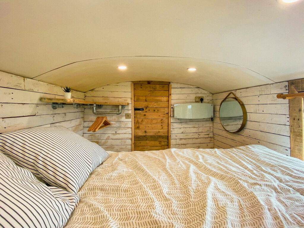 Cozy campervan interior with bed