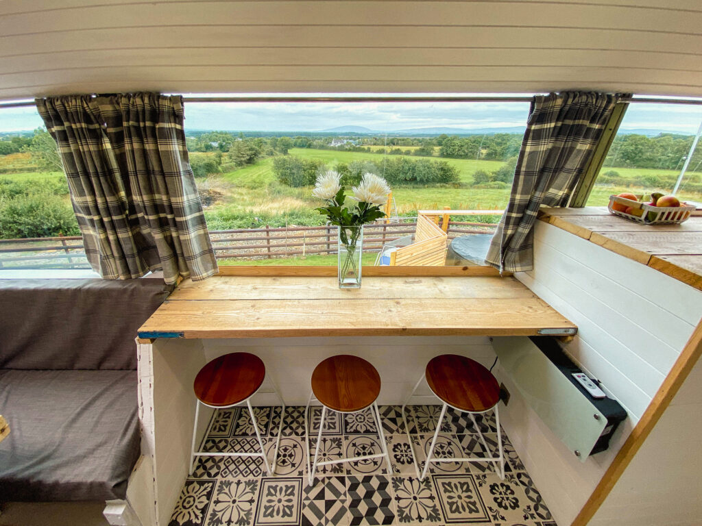 Cozy interior with scenic countryside view.