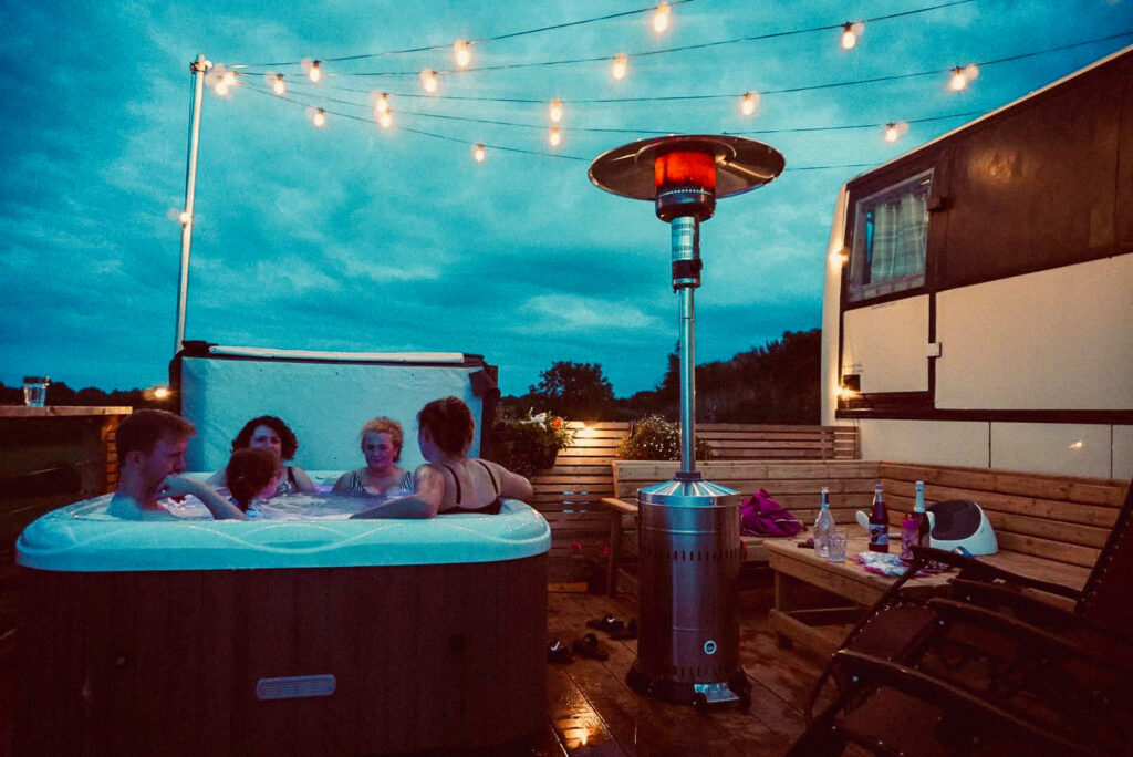 People enjoying hot tub at night