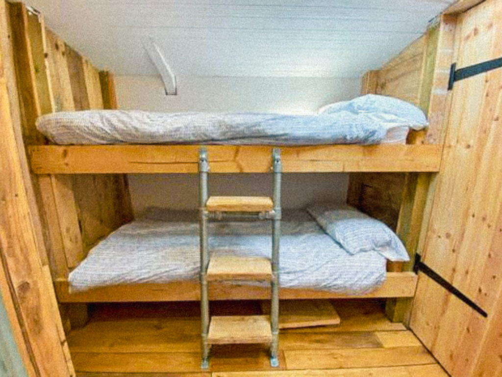 Cozy wooden bunk beds in cabin