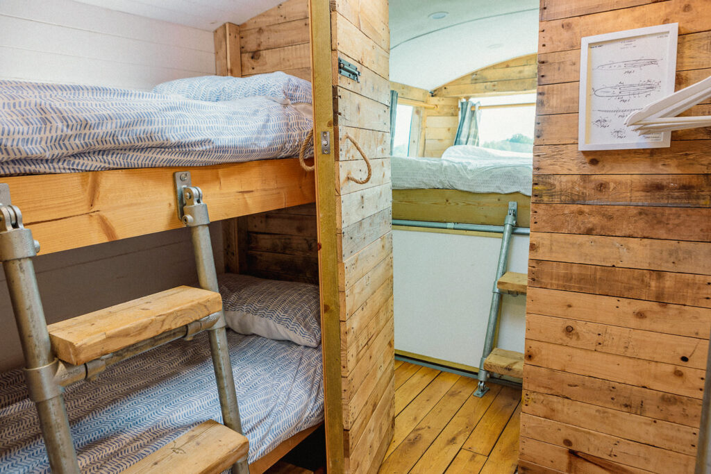 Cozy wooden bunk beds in campervan
