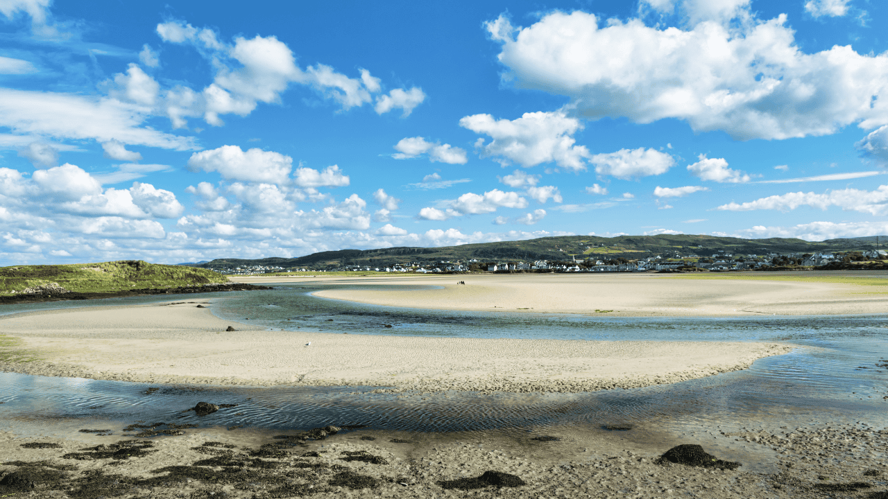 A tidal channel winding through the sandflats at Dunfanaghy Estuary.